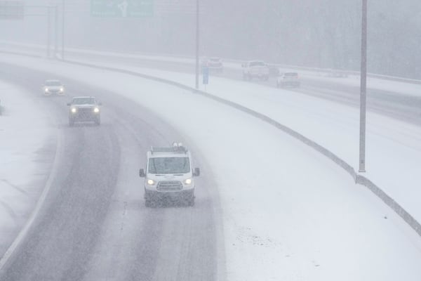 Traffic along Interstate 40 is seen in the snow Friday, Jan 10, 2025, in Nashville, Tenn. (AP Photo/George Walker IV)