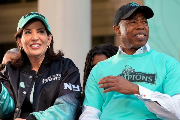 FILE — New York mayor Eric Adams, right, and New York governor Kathy Hochul attend a ceremony in honor of the New York Liberty's WNBA championship at City Hall in New York, Oct. 24, 2024. (AP Photo/Seth Wenig, File)