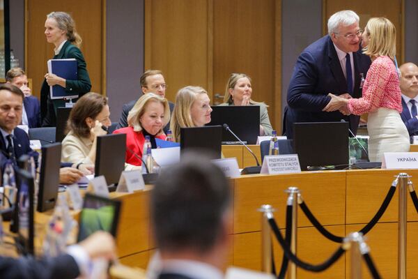 Ukraine's Foreign Minister Andrii Sybiha, second right, is greeted by European Union foreign policy chief Kaja Kallas during a meeting of EU foreign ministers at the European Council building in Brussels, Belgium, Tuesday, May 20, 2025. (Olivier Matthys, Pool Photo via AP)