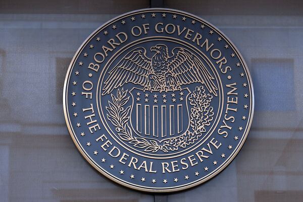 FILE - The seal of the Federal Reserve Board is seen at the Building in Washington, Saturday, Dec. 8, 2024. (AP Photo/Jose Luis Magana)