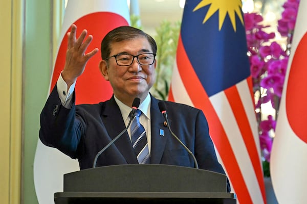 Japan's Prime Minister Shigeru Ishiba gestures during a joint press conference with Malaysia's Prime Minister Anwar Ibrahim at the prime minister's office in Putrajaya, Malaysia, Friday, Jan. 10, 2025. (Mohd Rasfan/Pool Photo via AP)