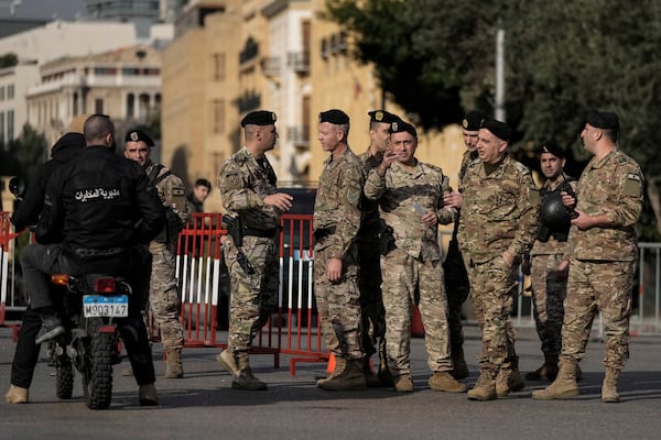 Lebanese army soldiers block a road that leads to the parliament building while lawmakers gather to elect a president in Beirut, Lebanon, Thursday, Jan. 9, 2025. (AP Photo/Bilal Hussein)