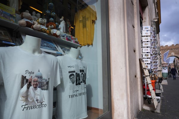 A shop selling a T-shirt displaying Pope Francis, in Rome, Friday, Feb. 28, 2025. (AP Photo/Kirsty Wigglesworth)