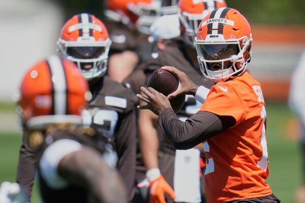 Cleveland Browns quarterback Shedeur Sanders throws during the NFL football team's rookie minicamp in Berea, Ohio, Friday, May 9, 2025. (AP Photo/Sue Ogrocki)