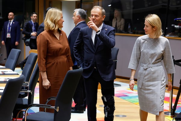 Poland's Prime Minister Donald Tusk, center, speaks with Latvia's Prime Minister Evika Silina, left, and European Union foreign policy chief Kaja Kallas during a round table meeting at an EU Summit in Brussels, Thursday, March 6, 2025. (AP Photo/Geert Vanden Wijngaert)