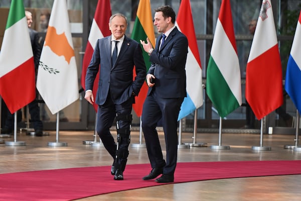 Poland's Prime Minister Donald Tusk, left, arrives for an EU Summit at the European Council building in Brussels, Thursday, March 6, 2025. (AP Photo/Harry Nakos)