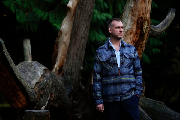 Recreational rugby player Sean McDowell, whose SafeSport case investigator Jason Krasley was fired after being arrested for stealing drug money in his previous job as a police officer, poses for a portrait Wednesday, Dec. 18, 2024, in Seattle. (AP Photo/Lindsey Wasson)