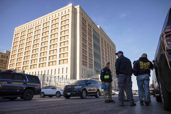 FILE - Federal enforcement officers stand outside the Metropolitan Detention Center, where Sean "Diddy" Combs is incarcerated on Oct. 28, 2024, in the Brooklyn Borough of New York. (AP Photo/Yuki Iwamura, File)