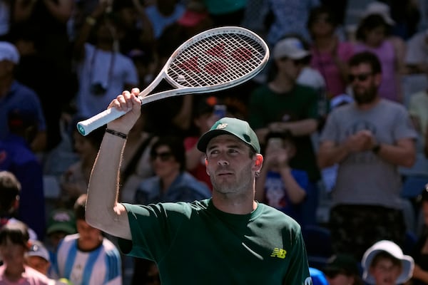 Tommy Paul of the U.S. celebrates after defeating Roberto Carballes Baena of Spain in their third round match at the Australian Open tennis championship in Melbourne, Australia, Friday, Jan. 17, 2025. (AP Photo/Manish Swarup)