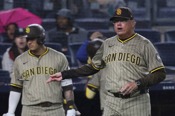 San Diego Padres manager Mike Shildt, right, tosses a pen as he argues with umpire Adrian Johnson during the eighth inning of a baseball game against the New York Yankees Monday, May 5, 2025, in New York. (AP Photo/Pamela Smith)