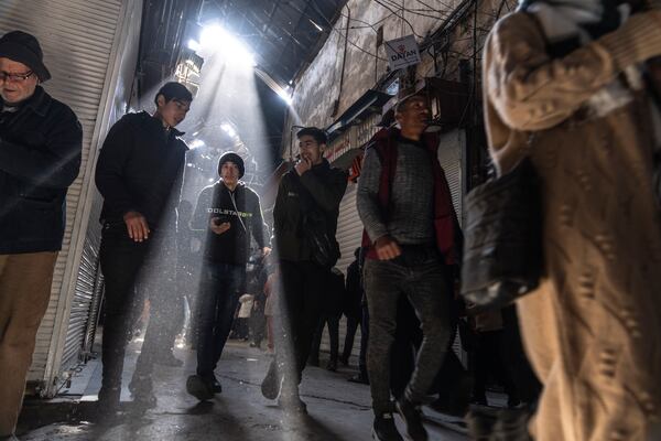 People walk through an alleyway in Al-Hamidiyeh Souq, in Damascus, Syria, Friday, Jan. 10, 2025. (AP Photo/Mosa'ab Elshamy)