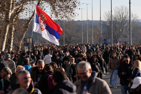 People march during a protest over the collapse of a concrete canopy that killed 15 people more than two months ago, in Novi Sad, Serbia, Saturday, Feb. 1, 2025. (AP Photo/Darko Vojinovic)