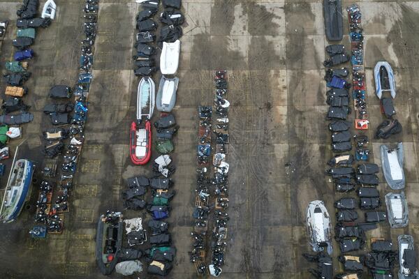 FILE - A general view of small boats and inflatable dinghies in a Border Force compound after being confiscated from migrants attempting to cross the channel to Britain from France, in Dover, England, Feb. 26, 2025. (AP Photo, file)