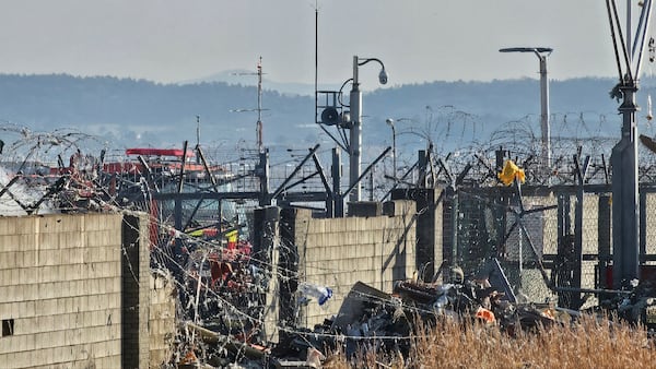 A rescue team works to extinguish a fire at the Muan International Airport in Muan, South Korea, Sunday, Dec. 29, 2024. (Maeng Dae-hwan/Newsis via AP)