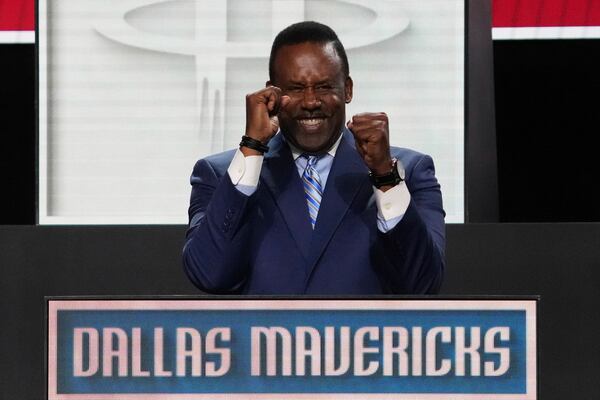 Dallas Mavericks' Rolando Blackman celebrates after NBA Deputy Commissioner Mark Tatum announced that the Mavericks won the first pick in the NBA basketball draft lottery in Chicago, Monday, May 12, 2025. (AP Photo/Nam Y. Huh)