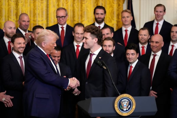 President Donald Trump shakes hands with Matthew Tkachuk during a ceremony with the Florida Panthers NHL hockey team to celebrate their 2024 Stanley Cup victory in the East Room of the the White House, Monday, Feb. 3, 2025, in Washington. (AP Photo/Alex Brandon)