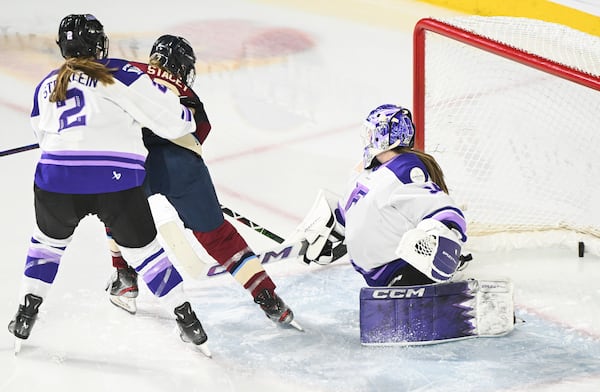 Minnesota Frost goaltender Maddie Rooney (35) is scored on by Montreal Victoire's Laura Stacey (7) as Frost's Lee Stecklein (2) defends during second period PWHL hockey action in Laval, Quebec, Tuesday, March 4, 2025. (Graham Hughes/The Canadian Press via AP)