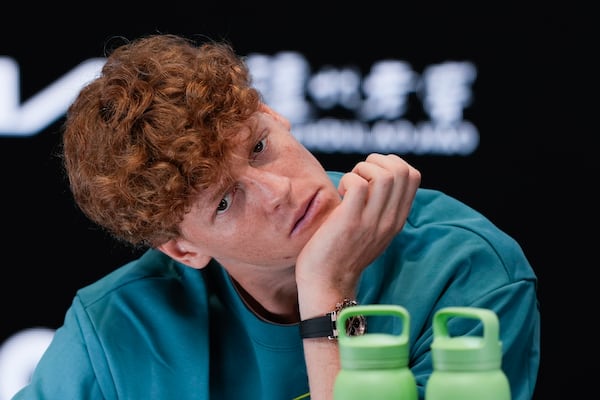 Italy's Jannik Sinner reacts during a press conference ahead of the Australian Open tennis championship in Melbourne, Australia, Friday, Jan. 10, 2025. (AP Photo/Ng Han Guan)