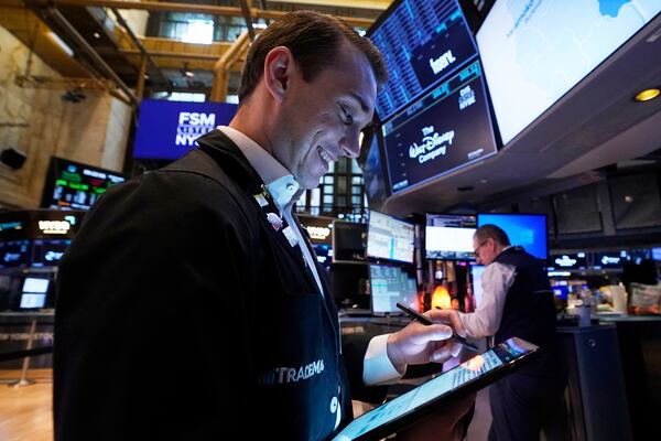 Trader Dylan Halvorsan works on the floor of the New York Stock Exchange, Wednesday, May 7, 2025. (AP Photo/Richard Drew)
