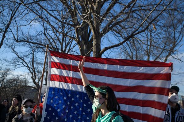 Demonstrators protest across the street from the Capitol in the hours prior to President Donald Trump's address to a joint session of Congress at the Capitol, Tuesday, March 4, 2025, in Washington. (AP Photo/Rod Lamkey, Jr.)