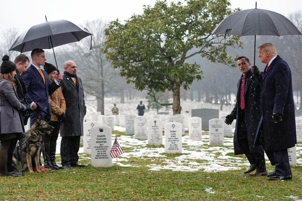 President-elect Donald Trump walks to greet the family of Marine Corps Staff Sgt. Darin Taylor Hoover during a visit to Section 60 at Arlington National Cemetery, Sunday, Jan. 19, 2025, in Arlington, Va. (AP Photo/Evan Vucci)