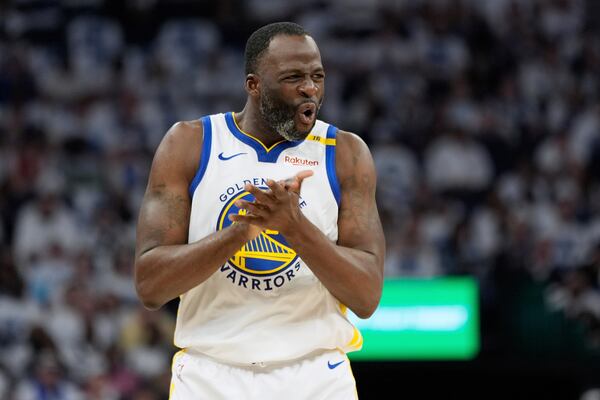 Golden State Warriors forward Draymond Green (23) reacts after missing a shot during the first half of Game 2 of an NBA basketball second-round playoff series against the Minnesota Timberwolves, Thursday, May 8, 2025, in Minneapolis. (AP Photo/Abbie Parr)