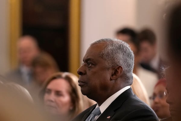 Defense Secretary Lloyd Austin listens as President Joe Biden speaks about foreign policy during a speech at the State Department in Washington, Monday, Jan. 13, 2025. (AP Photo/Susan Walsh)