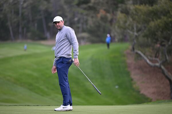 Scottie Scheffler watches his putt on the 13th hole during the first round of the AT&T Pebble Beach Pro-Am golf tournament, Thursday, Jan. 30, 2025, in Pebble Beach, Calif. (AP Photo/Nic Coury)