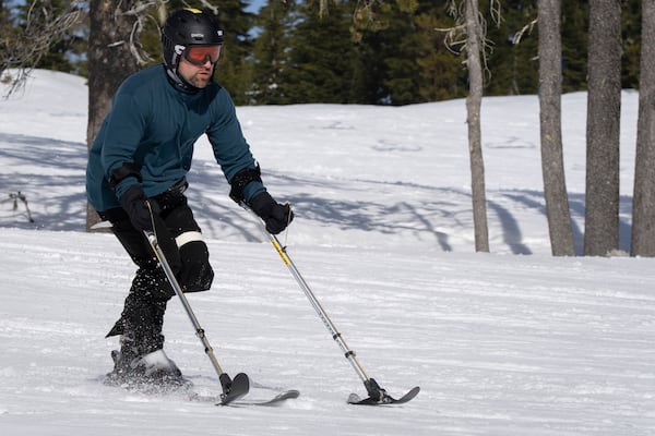 Ukrainian veteran Oleksandr Shvachka skis during a lesson with Oregon Adaptive Sports on the three track skiing method at Hoodoo Ski Area in central Oregon on Thursday, March 6, 2025. (AP Photo/Jenny Kane)