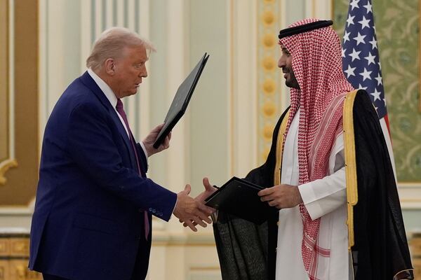 President Donald Trump and Saudi Crown Prince Mohammed bin Salman shake hands after exchanging documents during a signing ceremony at the Royal Palace in Riyadh, Saudi Arabia, Tuesday, May 13, 2025. (AP Photo/Alex Brandon)