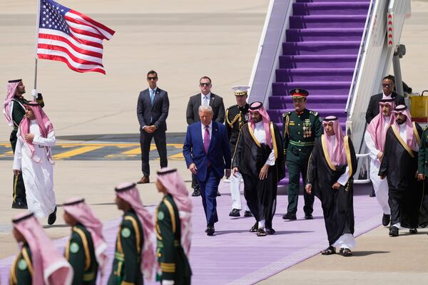 President Donald Trump walks with Saudi Crown Prince Mohammed bin Salman during an arrival ceremony at the Royal Terminal of King Khalid International Airport in Riyadh, Saudi Arabia, Tuesday, May 13, 2025.(AP Photo/Alex Brandon)