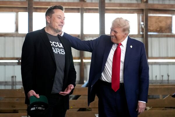 FILE - Tesla and SpaceX CEO Elon Musk, left, and Republican presidential nominee former President Donald Trump attend a campaign event at the Butler Farm Show, Oct. 5, 2024, in Butler, Pa. (AP Photo/Alex Brandon, File)