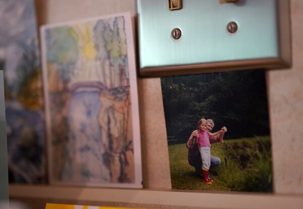 A photo of Zoey Stapleton and her father hangs in the kitchen of their family home, in Palmyra, Pa., Tuesday, July 2, 2024. Stapleton is a current postulant at the Franciscan Sisters, T.O.R. of Penance of the Sorrowful Mother. (AP Photo/Jessie Wardarski)