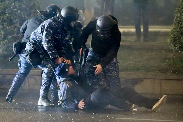 FILE - Police detain a demonstrator in Tbilisi, Georgia, on Dec. 3, 2024, during a protest of the government's decision to suspend negotiations on Georgia joining the European Union. (AP Photo/Zurab Tsertsvadze, File)