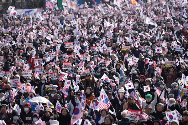 Supporters of impeached South Korean President Yoon Suk Yeol stage a rally to oppose his impeachment in Seoul, South Korea, Saturday, Jan. 18, 2025. (AP Photo/Lee Jin-man)