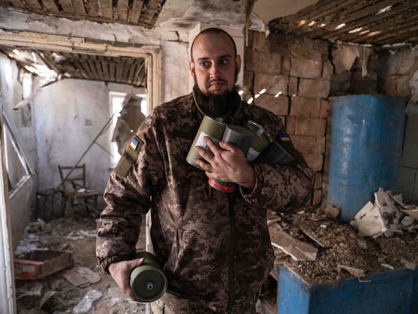 In this photo provided by Ukraine's 93rd Kholodnyi Yar Separate Mechanized Brigade press service, a soldier carries bombs for FPV drones in a shelter in Kramatorsk direction, Donetsk region, Ukraine, Saturday, March 22, 2025. (Iryna Rybakova/Ukraine's 93rd Mechanized Brigade via AP)