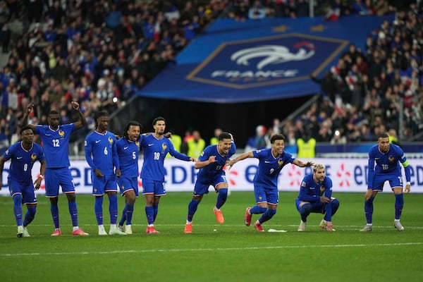 France players celebrate after winning the penalty shootout during the UEFA Nations League quarterfinal second leg soccer match between France and Croatia, at the Stade de France in Saint-Denis, outside Paris, Sunday, March 23, 2025. (AP Photo/Thibault Camus)