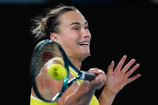 Aryna Sabalenka of Belarus plays a forehand return to Paula Badosa of Spain during their semifinal match at the Australian Open tennis championship in Melbourne, Australia, Thursday, Jan. 23, 2025. (AP Photo/Manish Swarup)