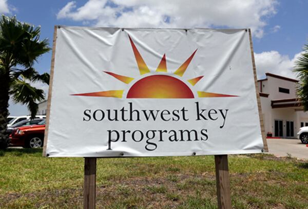 FILE - A Southwest Key Programs sign is displayed on June 20, 2014, in Brownsville, Texas. (AP Photo/Eric Gay, File)