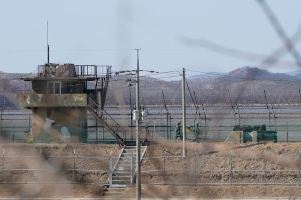 South Korean army soldiers patrol along the barbed-wire fence in Paju, South Korea, near the border with North Korea, Tuesday, Feb. 18, 2025. (AP Photo/Ahn Young-joon)