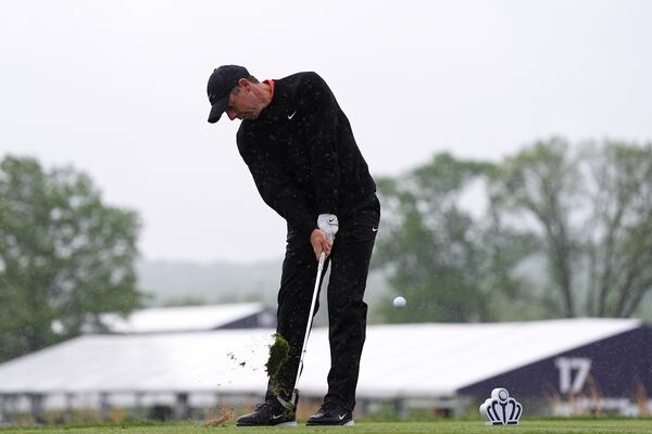 Rory McIlroy, of Northern Ireland, hits on the 14th hole during the second round of the Truist Championship golf tournament at the Philadelphia Cricket Club, Friday, May 9, 2025, in Flourtown. (AP Photo/Matt Rourke)