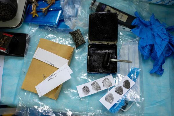 Fingerprints taken from the body of a Ukrainian prisoner of war returned by Russia, at a morgue in Kyiv, Ukraine, June 24, 2024. (AP Photo/Alex Babenko)