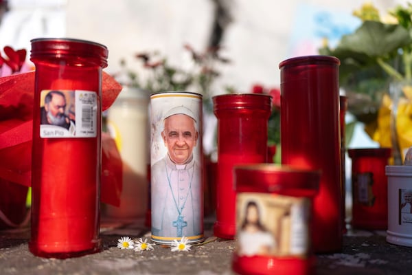 Candles left outside the Agostino Gemelli Polyclinic, in Rome, Monday, March 3, 2025 where Pope Francis is hospitalized since Friday, Feb. 14. (AP Photo/Mosa'ab Elshamy)