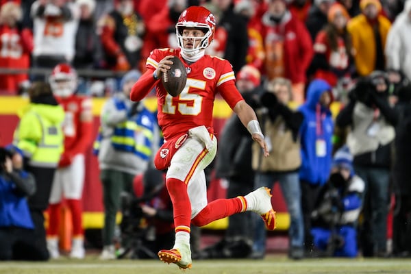 Kansas City Chiefs quarterback Patrick Mahomes (15) runs against the Buffalo Bills during the second half of the AFC Championship NFL football game, Sunday, Jan. 26, 2025, in Kansas City, Mo. (AP Photo/Reed Hoffmann)