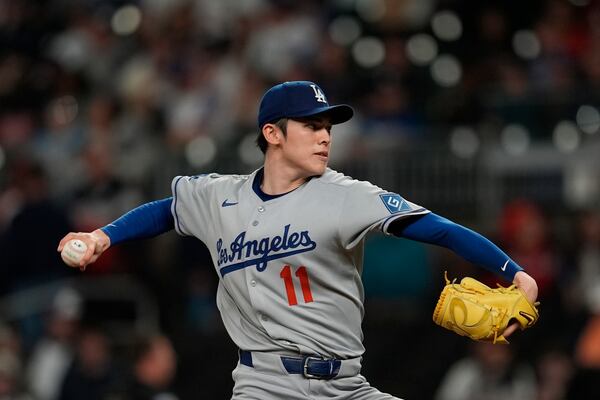 Los Angeles Dodgers pitcher Roki Sasaki (11) delivers against the Atlanta Braves in the first inning of a baseball game, Saturday, May 3, 2025, in Atlanta. (AP Photo/Mike Stewart)