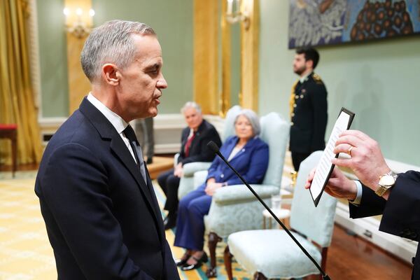 Mark Carney is sworn in as prime minister during a ceremony at Rideau Hall in Ottawa on Friday, March 14, 2025. (Sean Kilpatrick/The Canadian Press via AP)