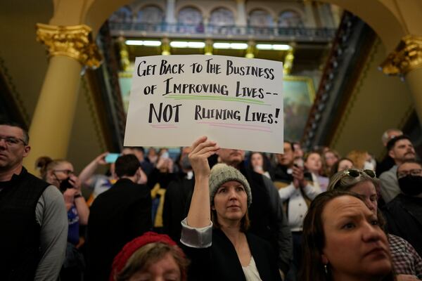 Protesters fill the Iowa state Capitol to denounce a bill that would strip the state civil rights code of protections based on gender identity, Thursday, Feb. 27, 2025, in Des Moines, Iowa. (AP Photo/Charlie Neibergall)