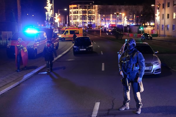 A police officer guards at a cordoned-off area near a Christmas Market after an incident in Magdeburg, Germany, Friday, Dec. 20, 2024. (AP Photo/Ebrahim Noroozi)