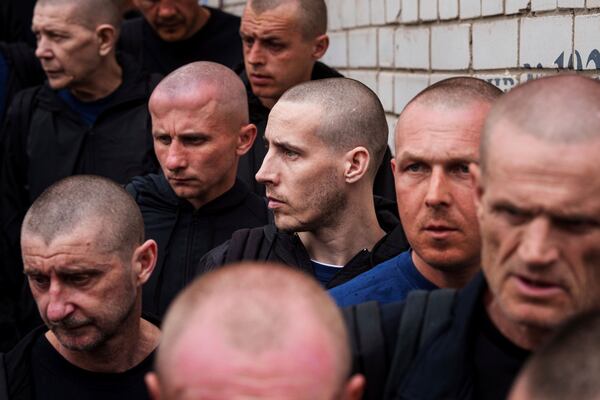 Ukrainian soldiers walk after a POWs exchange between Russia and Ukraine, in Chernyhiv region, Ukraine, Saturday, May 24, 2025. (AP Photo/Evgeniy Maloletka)