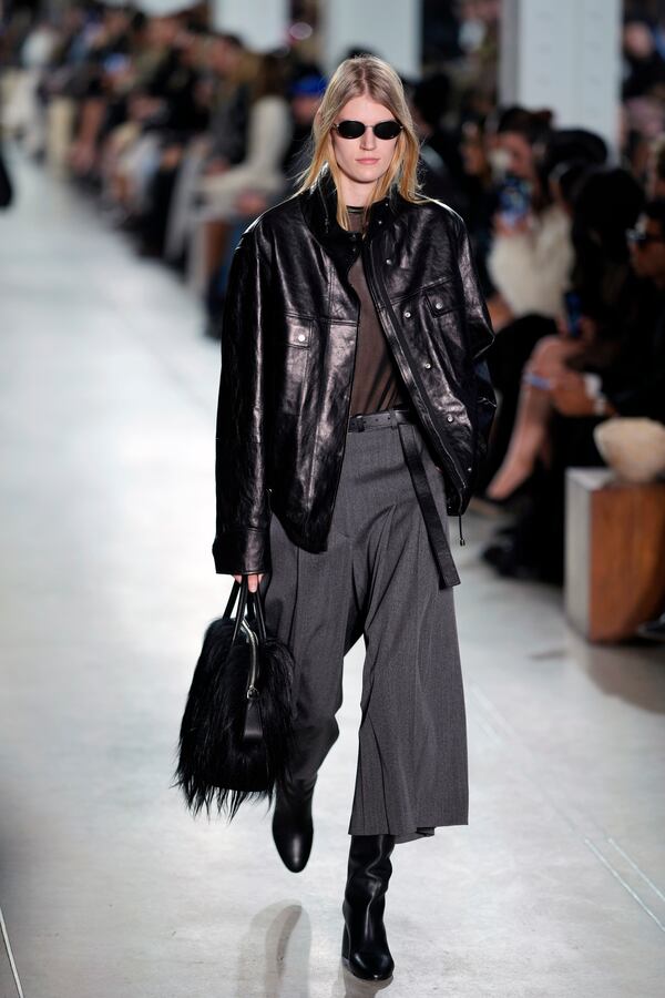 A model walks the runway during the Michael Kors Fall/Winter 2025 fashion show as part of New York Fashion Week on Tuesday, Feb. 11, 2025, at Terminal Warehouse in New York. (Photo by Charles Sykes/Invision/AP)